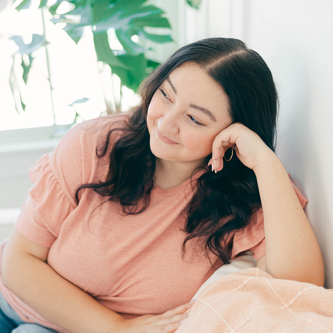 graphic designer sitting on couch