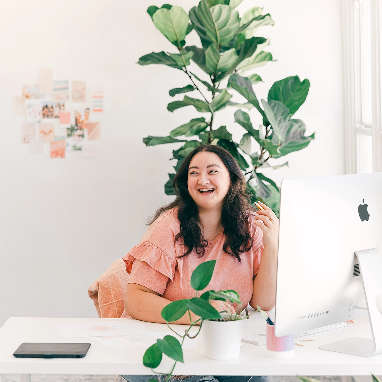 graphic designer at desk working on computer